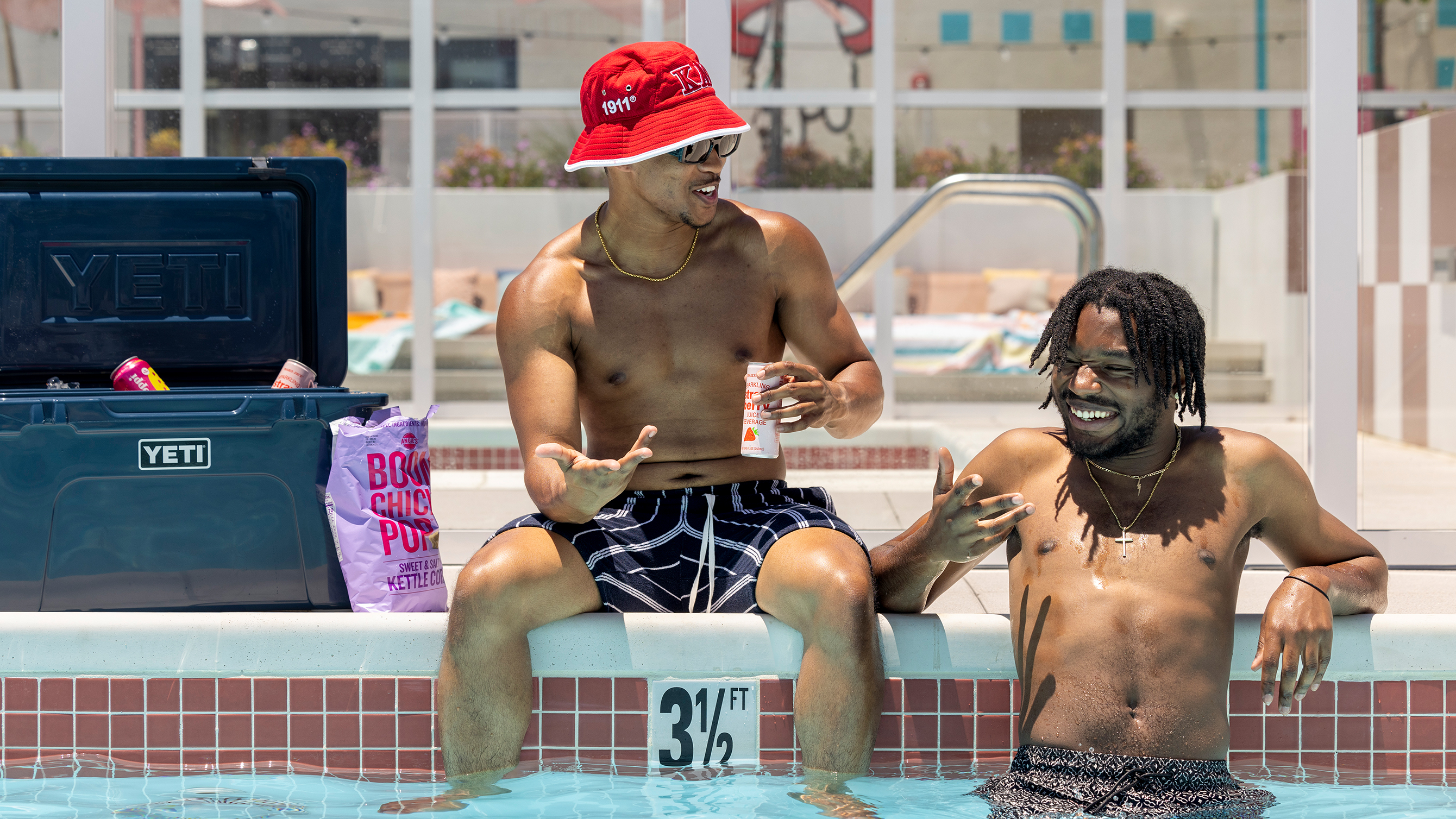 Friends talking in a swimming pool